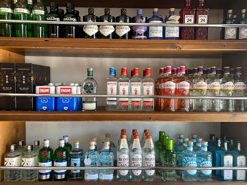 Gin shelf with international and Greek labels